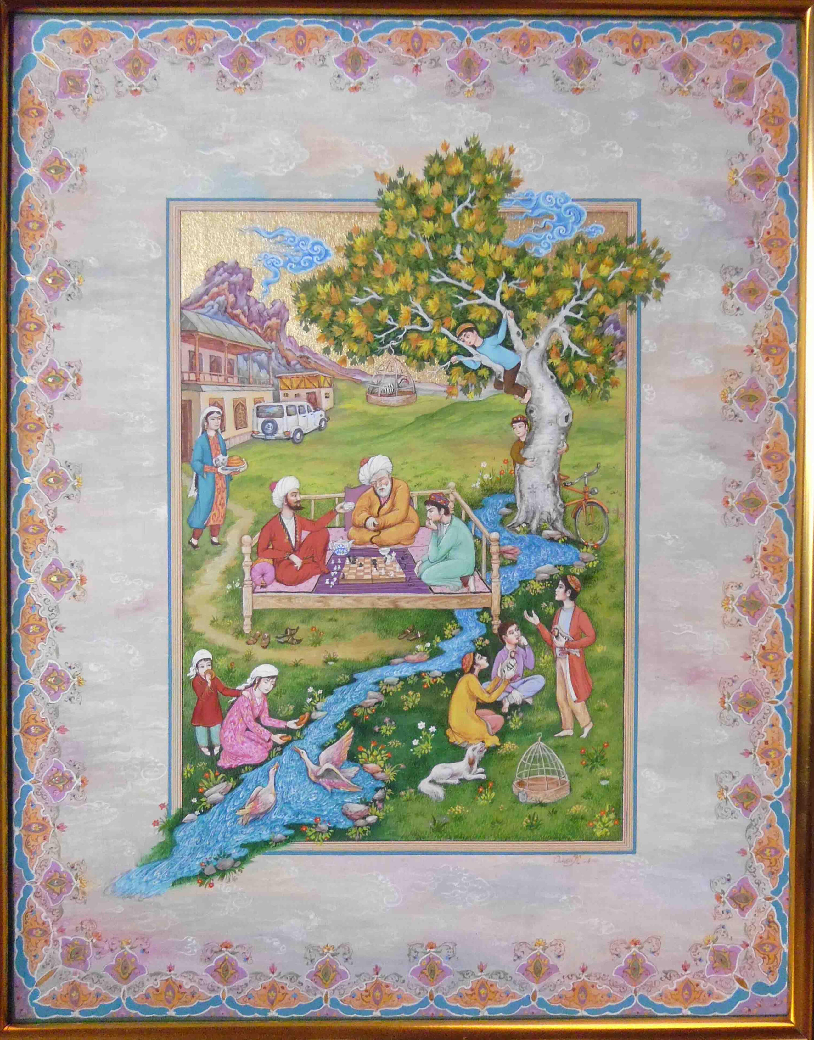 Olim Kamolzoda is the Honoured Artist of the Republic of Tajikistan. Photo of Olim Kamolzoda sitting at the desk in his workshop. He is the Honoured Artist of the Republic of Tajikistan, a Member of the Union of Artists of the Republic of Tajikistan, and a Specialist of the Miniature Art. Studying the specifics of the work