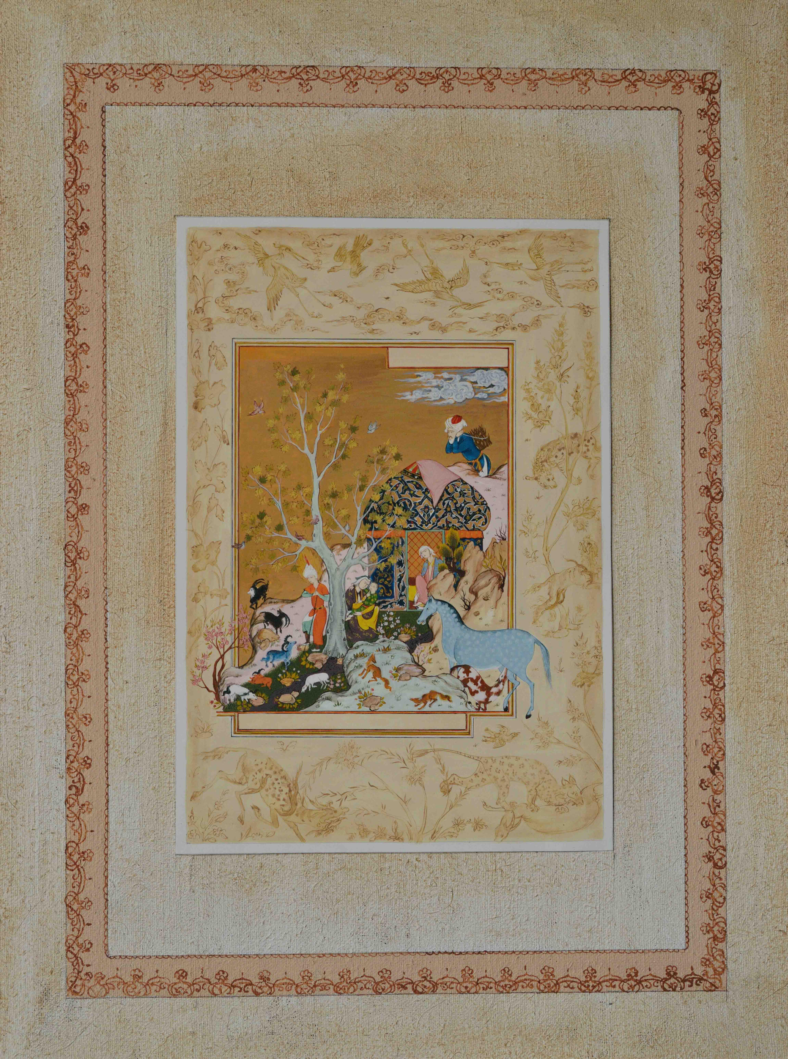 Olim Kamolzoda is the Honoured Artist of the Republic of Tajikistan. Photo of Olim Kamolzoda sitting at the desk in his workshop. He is the Honoured Artist of the Republic of Tajikistan, a Member of the Union of Artists of the Republic of Tajikistan, and a Specialist of the Miniature Art. Studying the specifics of the work